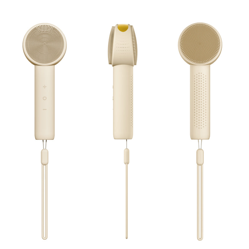 Liorae Cléa sonic cleanser in cream with gold accent and hanging lanyard